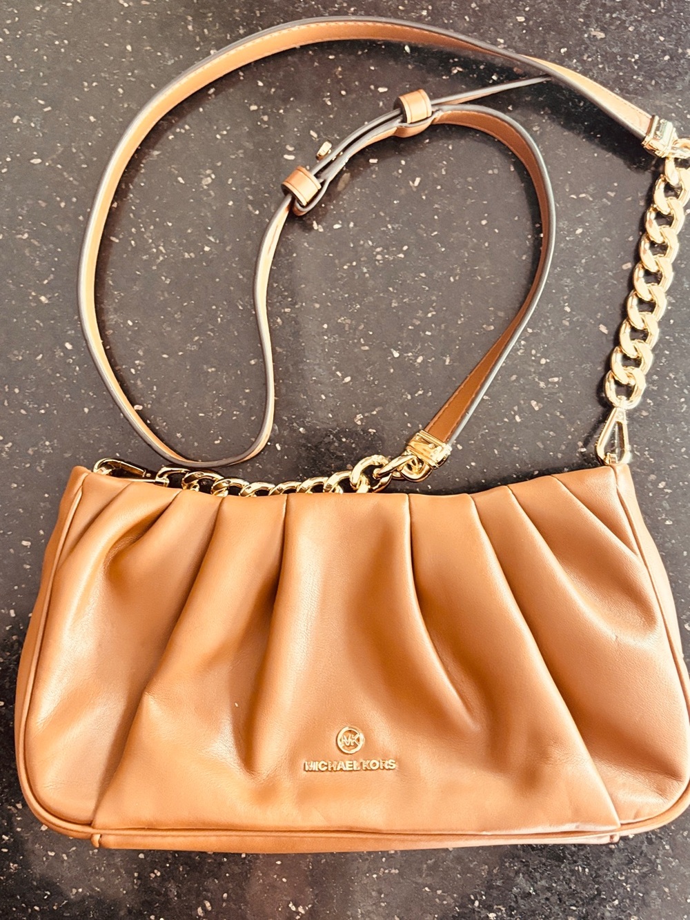 Michael Kors Hannah Small Convertible Clutch in a luggage brown color 10x6